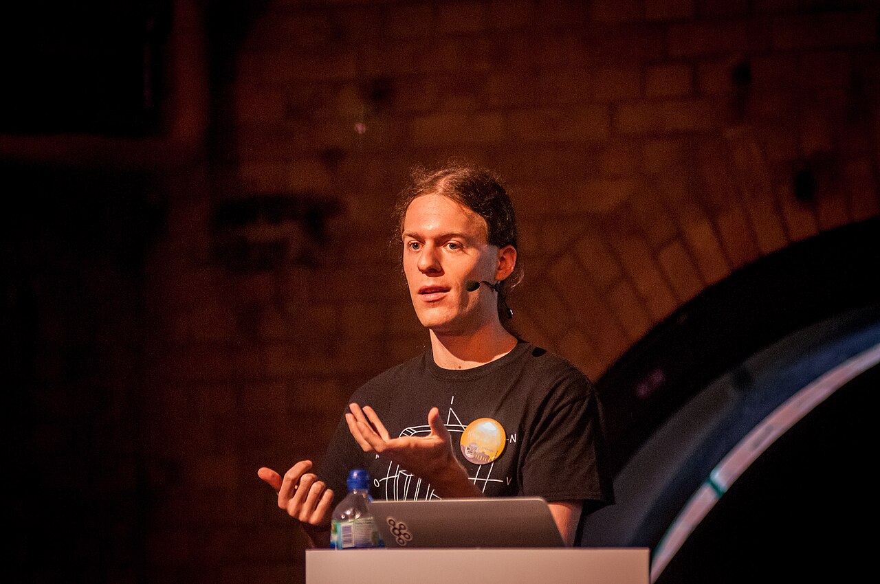 Martin Kleppmann, one of the essay's authors, speaking on stage at Berlin Buzzwords 2014.